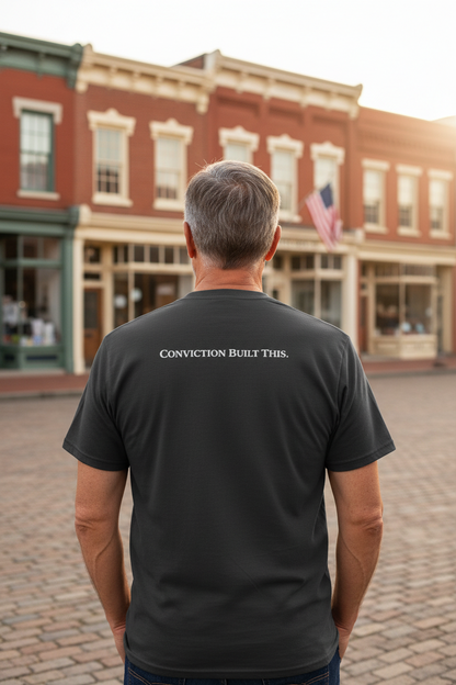 Black t-shirt with 'Conviction Built This' text on the back against a white background