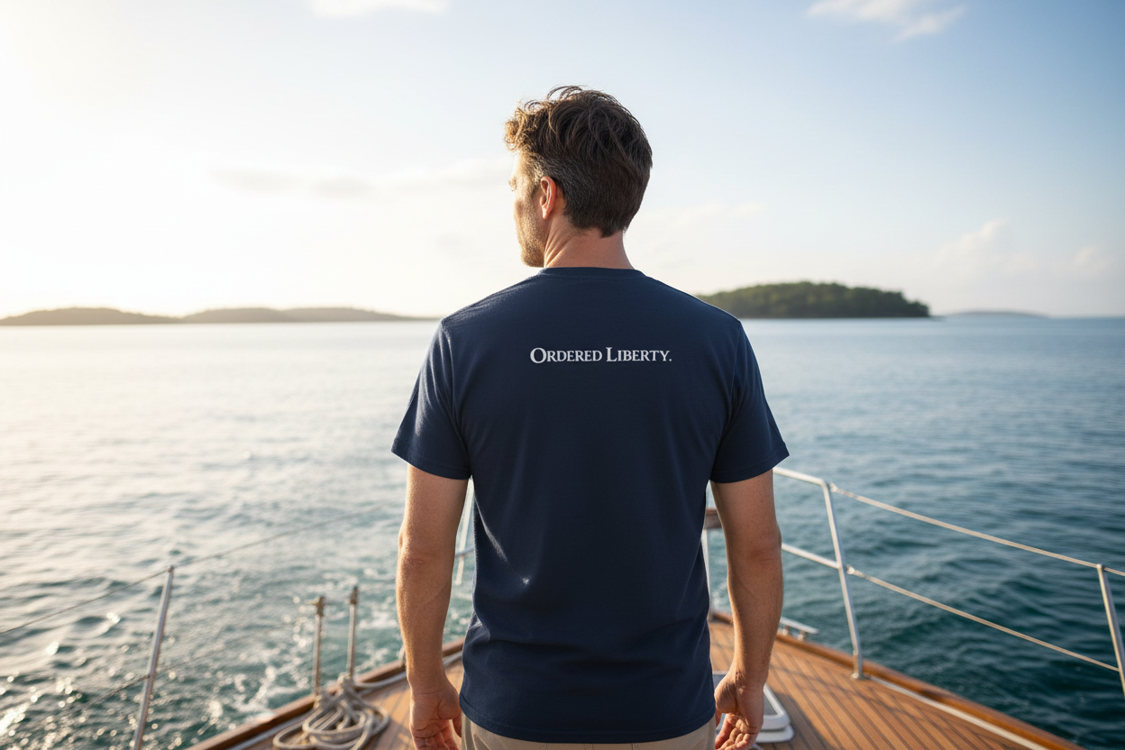 Navy blue t-shirt with 'Ordered Liberty' text on the back against a white background