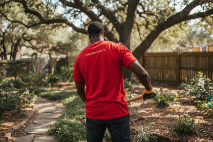 Red t-shirt with 'Obedient Liberty' text on the back against a white background
